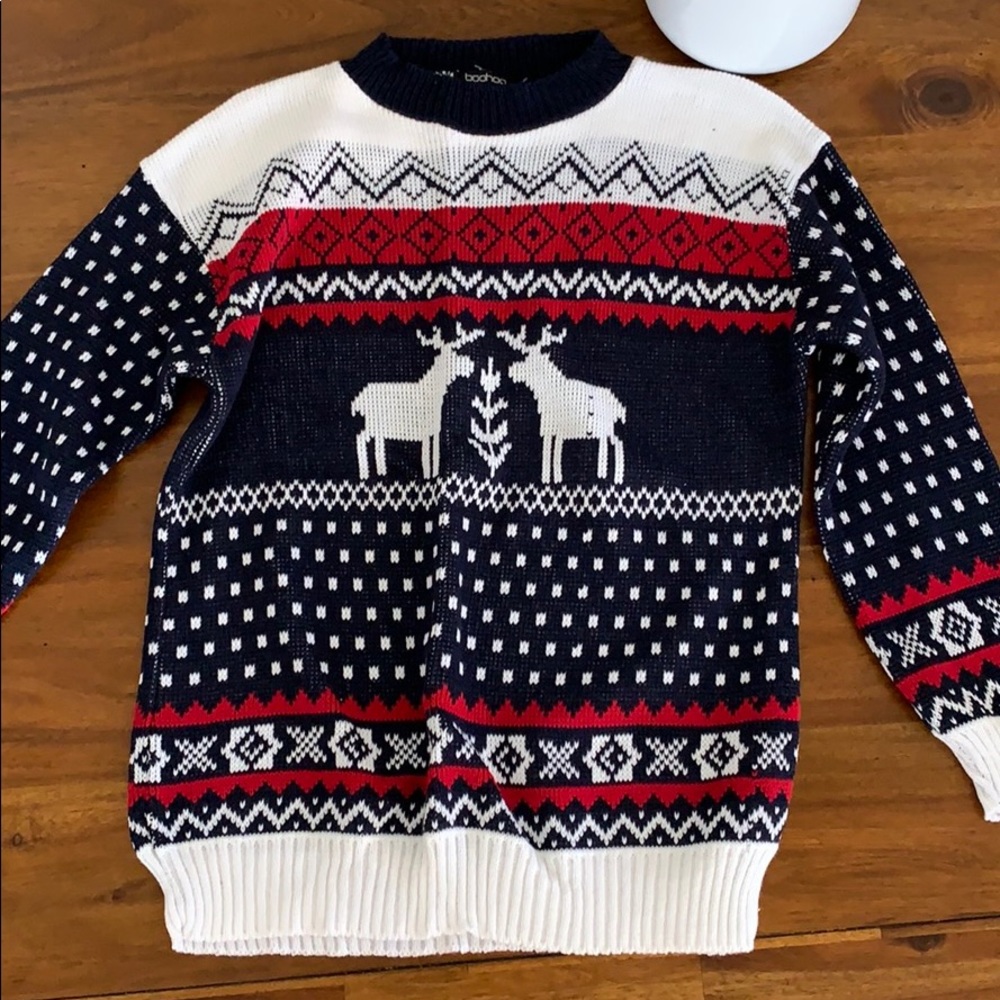 Blue and white knit sweater with deer design